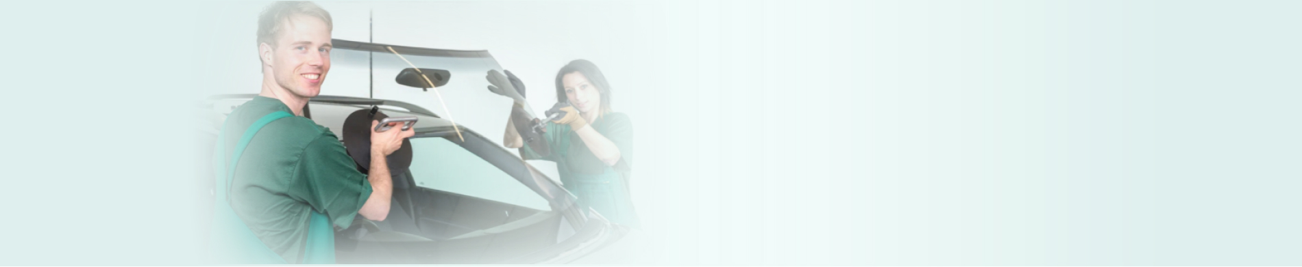 Technician repairing car windshield